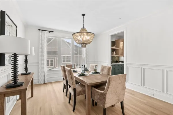 a view of a dining room with furniture window and wooden floor