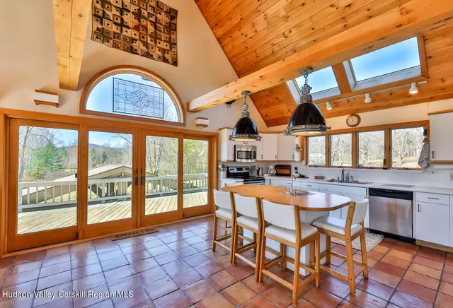 a building outdoor space with patio furniture and a potted plant
