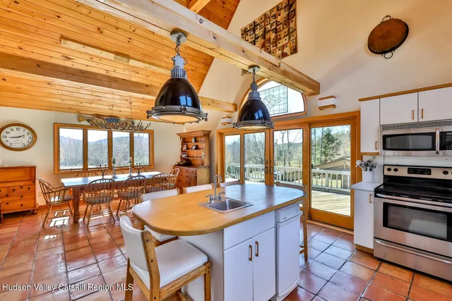 a view of kitchen island with furniture and flat screen tv