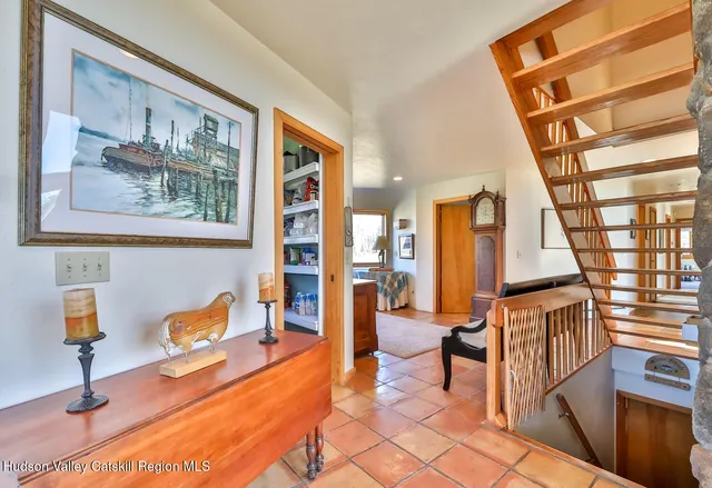 a bedroom with a bed and glass window