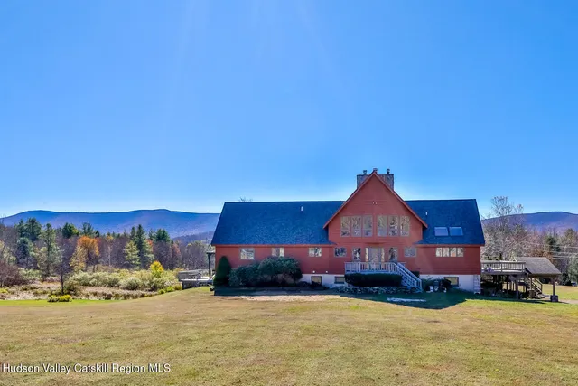 a very nice looking dining room with a large window
