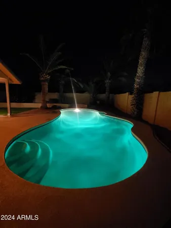 a view of a golf course with a swimming pool