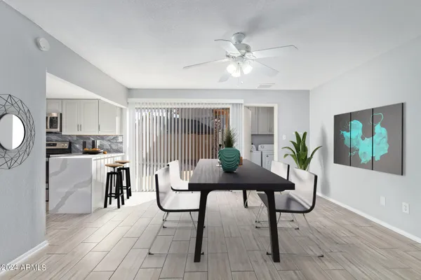 a view of a dining room with furniture and wooden floor