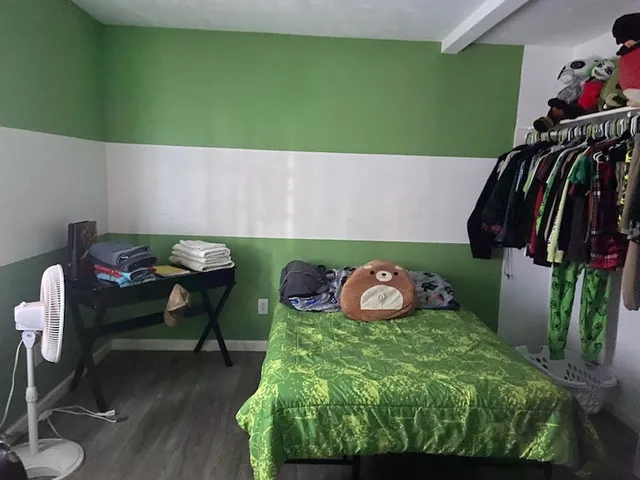 a room with furniture and a wooden floor