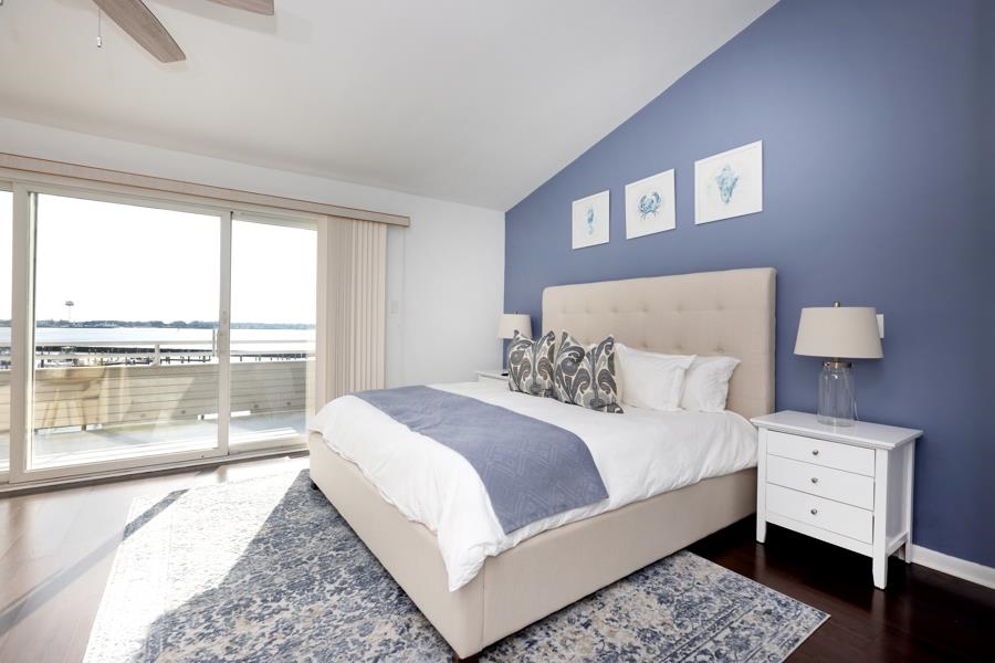 902 Ocean, Unit 906 Cape May, NJ 08204 - Photo 18 of 46 a bedroom with a large bed and a large window