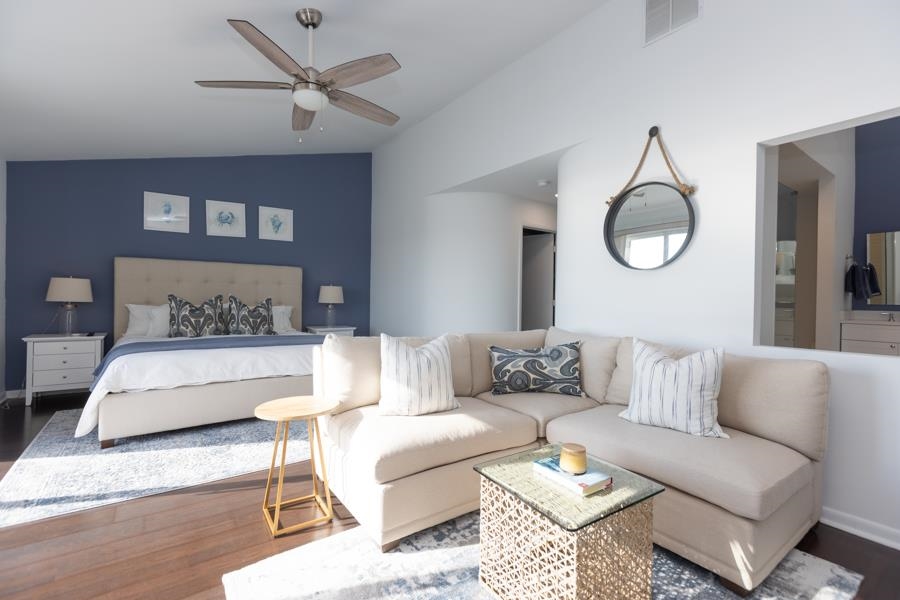 902 Ocean, Unit 906 Cape May, NJ 08204 - Photo 22 of 46 a living room with furniture a clock and a rug