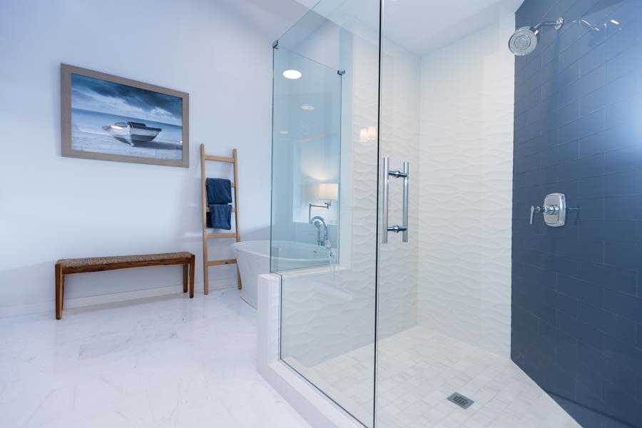 902 Ocean, Unit 906 Cape May, NJ 08204 - Photo 24 of 46 a bathroom with a bathtub and a shower