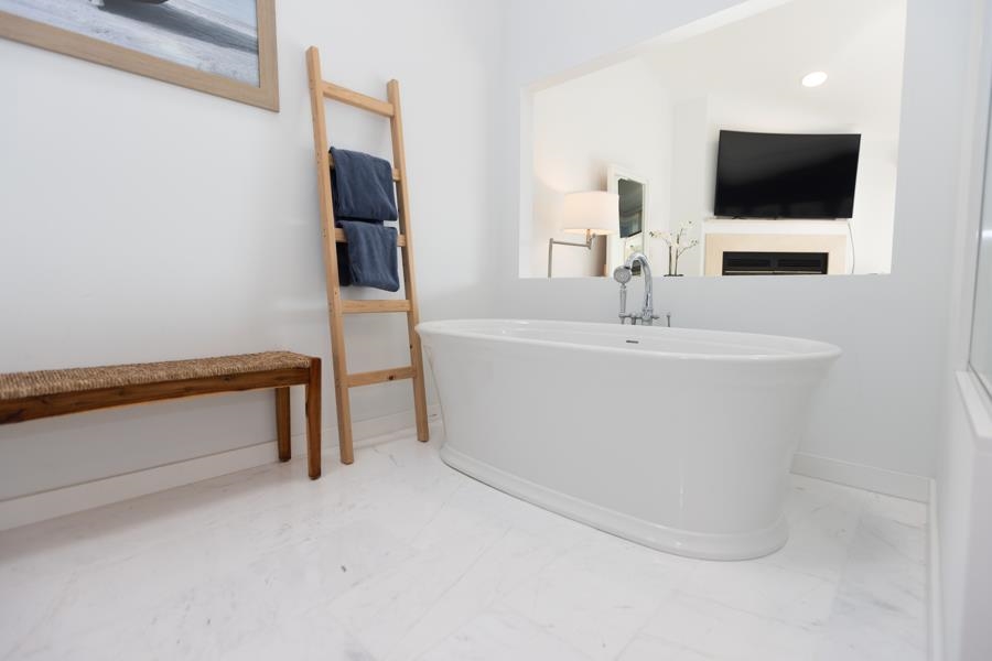 902 Ocean, Unit 906 Cape May, NJ 08204 - Photo 26 of 46 a bathroom with a sink and a mirror