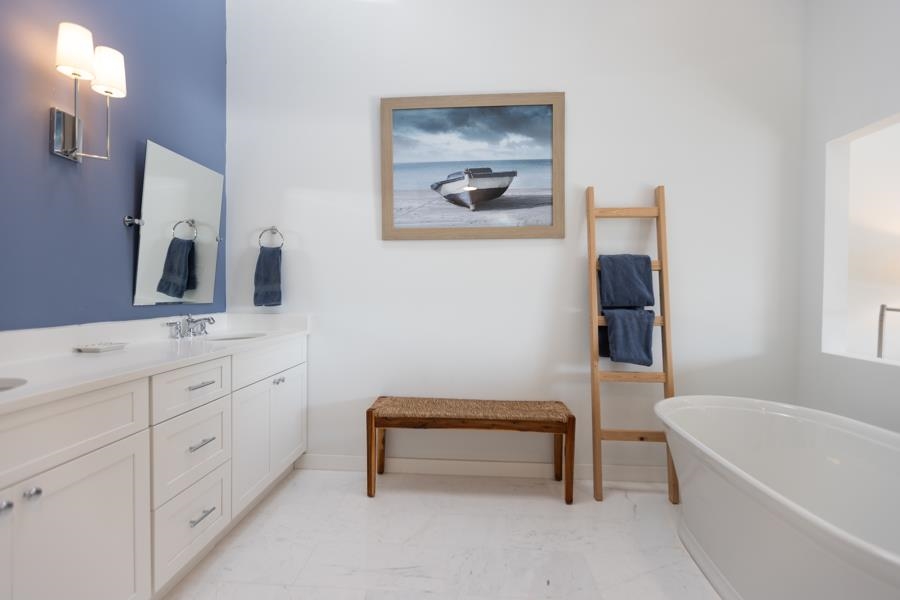 902 Ocean, Unit 906 Cape May, NJ 08204 - Photo 27 of 46 a bathroom with a tub sink and mirror
