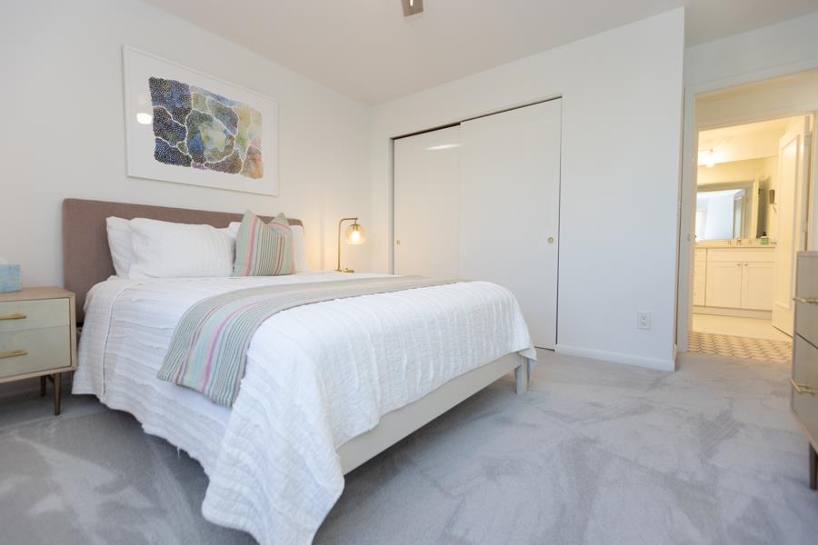 902 Ocean, Unit 906 Cape May, NJ 08204 - Photo 29 of 46 a bedroom with a bed and a painting on the wall