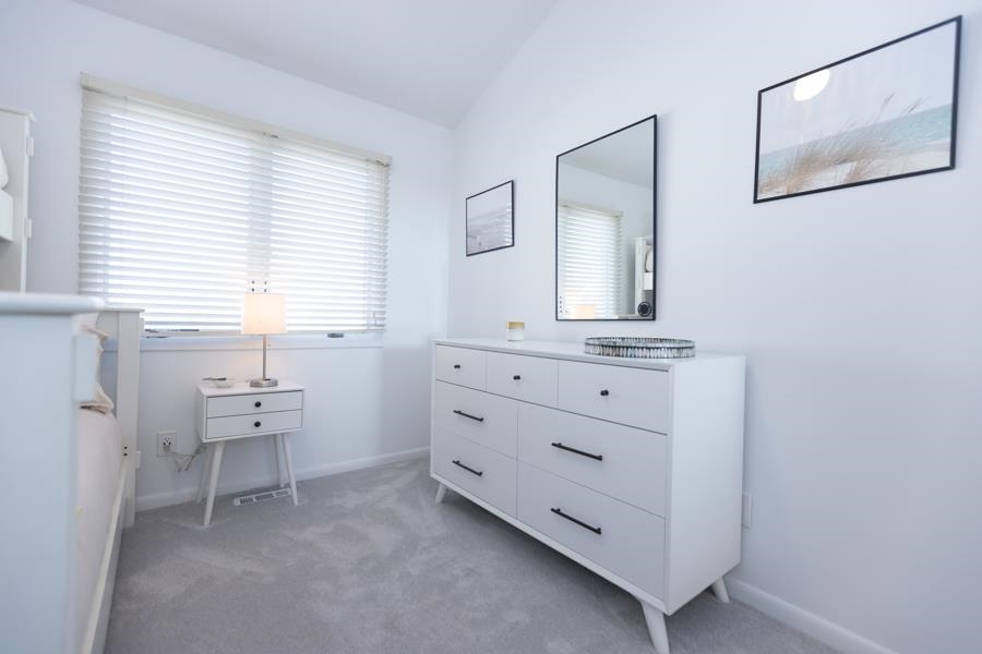 902 Ocean, Unit 906 Cape May, NJ 08204 - Photo 32 of 46 a room with a mirror and a window