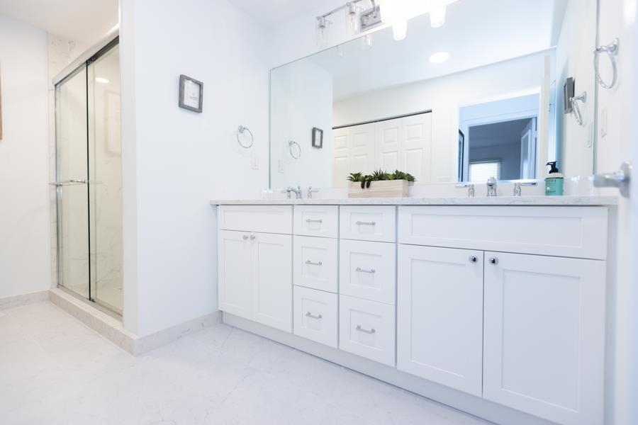 902 Ocean, Unit 906 Cape May, NJ 08204 - Photo 33 of 46 a bathroom with white cabinets