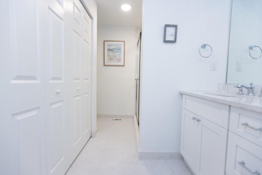 902 Ocean, Unit 906 Cape May, NJ 08204 - Photo 34 of 46 a bathroom with a sink and a mirror