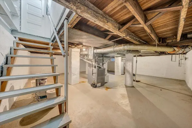 a view of empty room with wooden walls