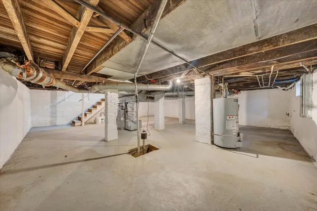 a backyard of a house with a trees and plants
