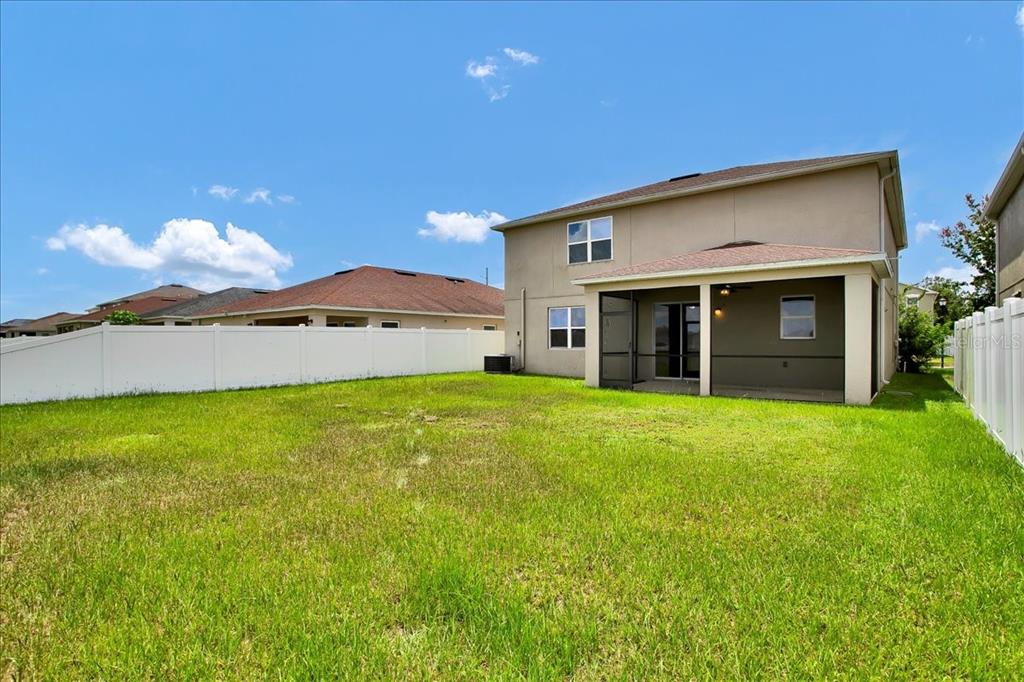 11544 Brighton Knoll Loop Riverview, FL 33579 - Photo 13 of 65 a front view of a house with a garden and yard