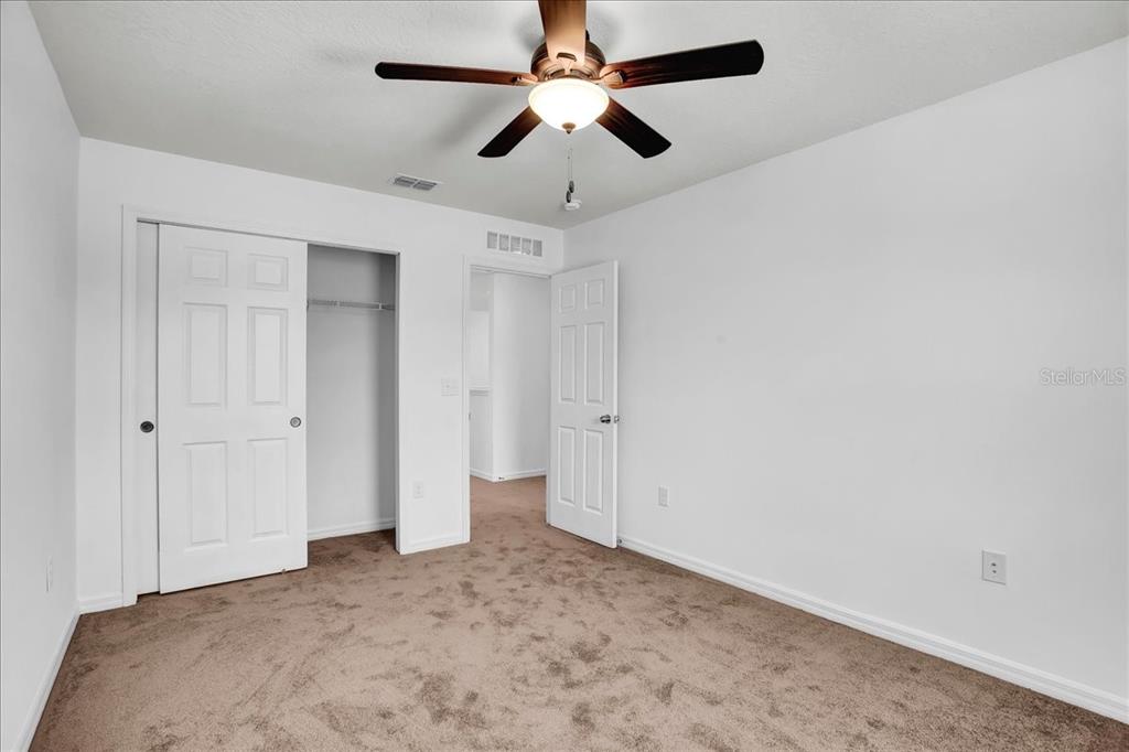 11544 Brighton Knoll Loop Riverview, FL 33579 - Photo 20 of 65 an empty room with chandelier fan