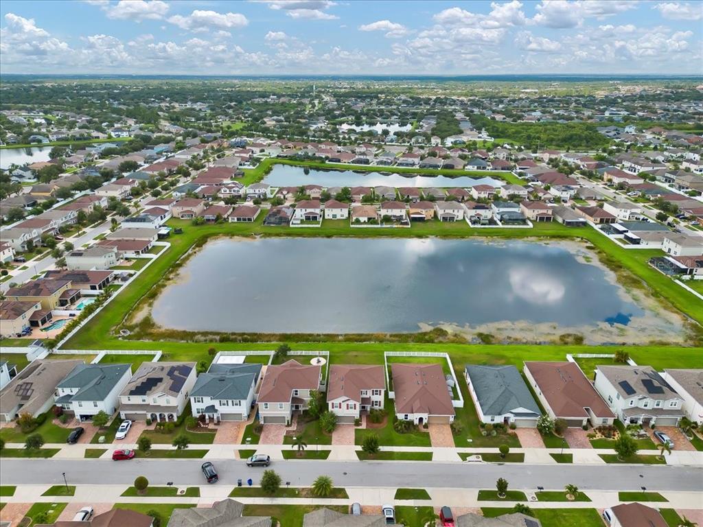 11544 Brighton Knoll Loop Riverview, FL 33579 - Photo 26 of 65 an aerial view of residential building and lake