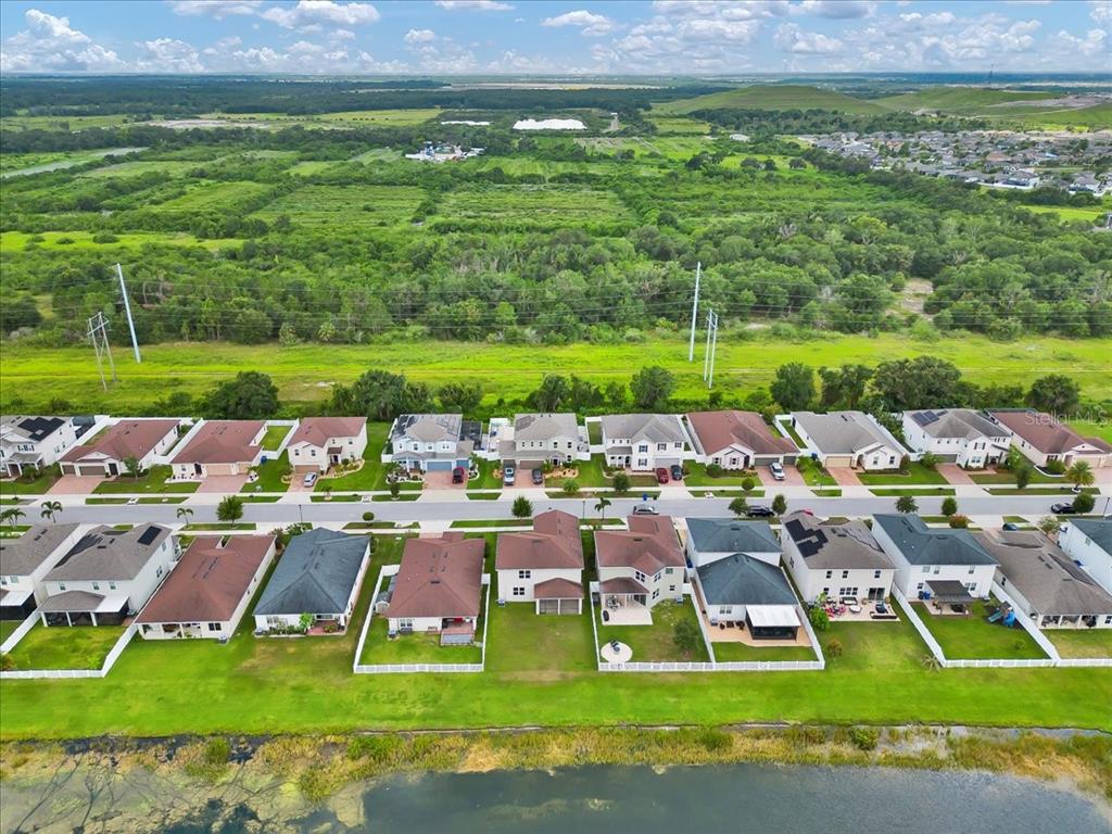 11544 Brighton Knoll Loop Riverview, FL 33579 - Photo 27 of 65 a view of a city with lawn chairs and a big yard