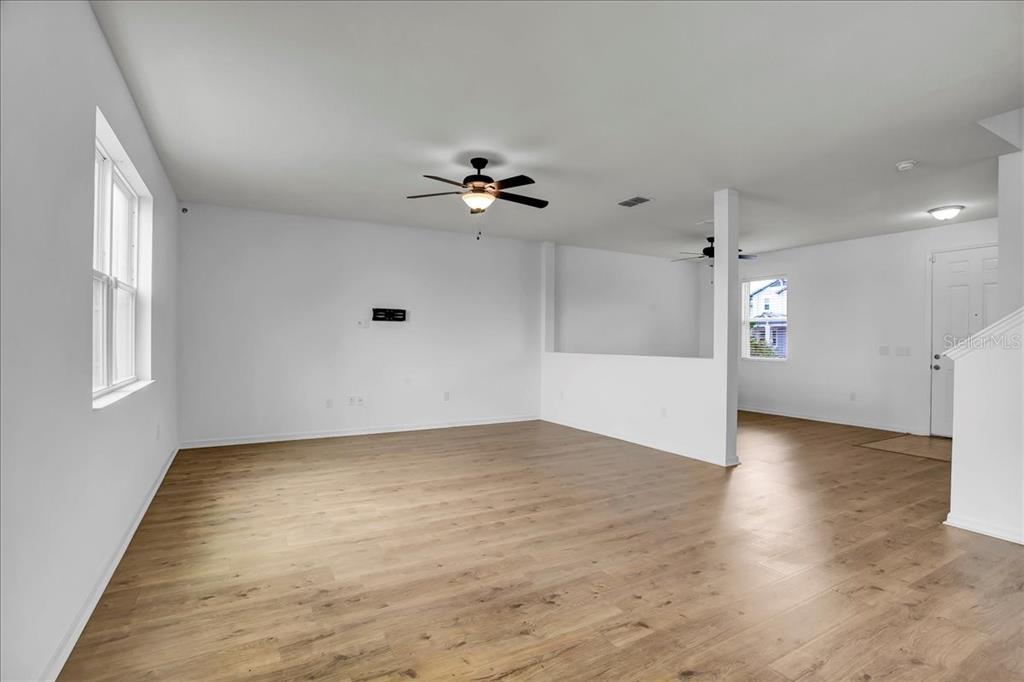 11544 Brighton Knoll Loop Riverview, FL 33579 - Photo 37 of 65 wooden floor in an empty room with a window