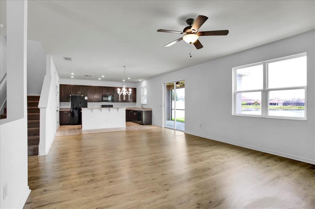11544 Brighton Knoll Loop Riverview, FL 33579 - Photo 39 of 65 a view of a kitchen with microwave and wooden floor