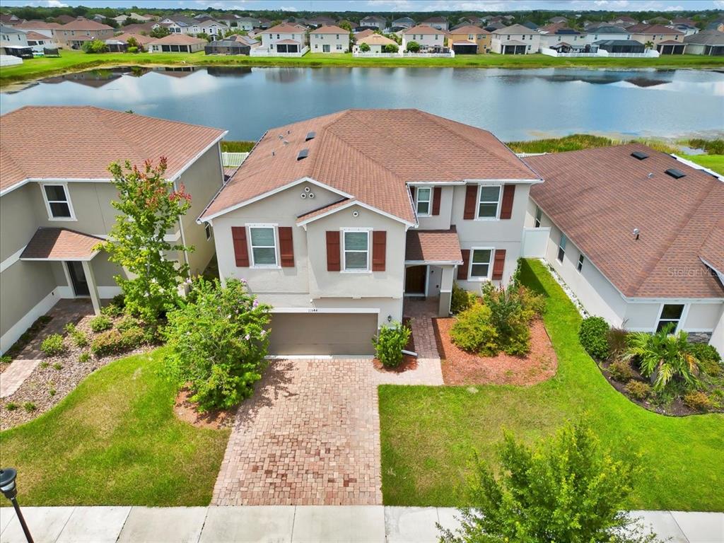 11544 Brighton Knoll Loop Riverview, FL 33579 - Photo 4 of 65 an aerial view of a house with a lake view