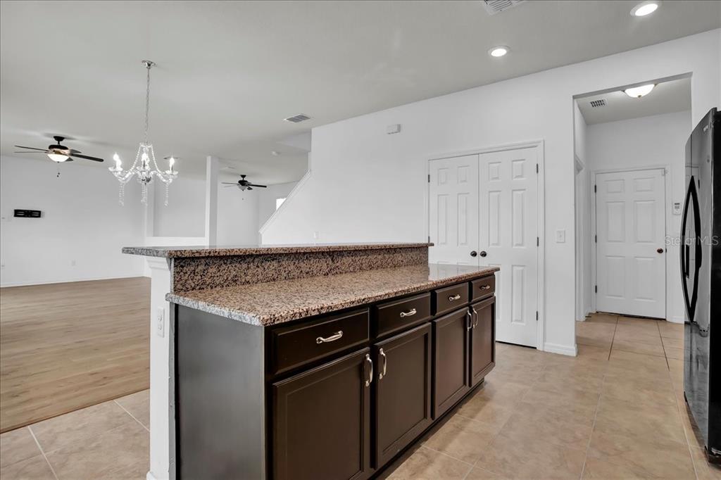 11544 Brighton Knoll Loop Riverview, FL 33579 - Photo 45 of 65 a kitchen with a sink and a refrigerator