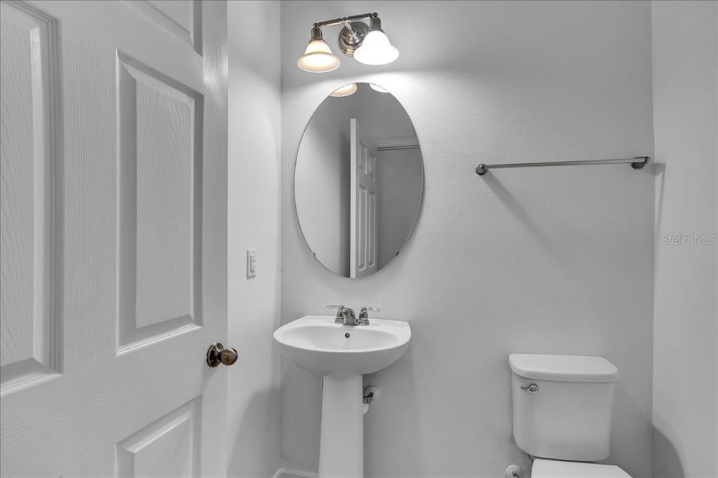 11544 Brighton Knoll Loop Riverview, FL 33579 - Photo 50 of 65 a bathroom with a sink and a mirror