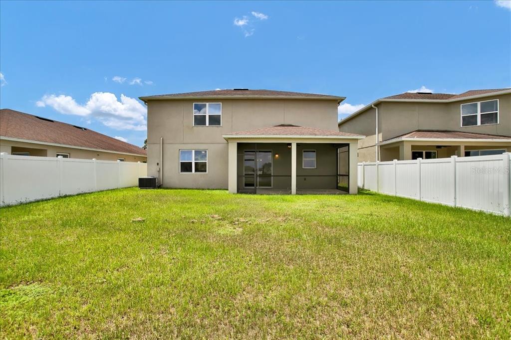 11544 Brighton Knoll Loop Riverview, FL 33579 - Photo 5 of 65 a front view of a house with a garden and yard