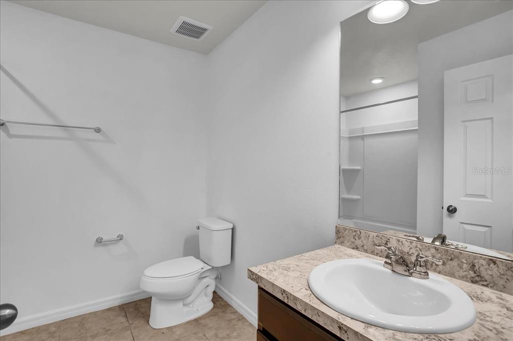 11544 Brighton Knoll Loop Riverview, FL 33579 - Photo 59 of 65 a bathroom with a sink toilet and a mirror