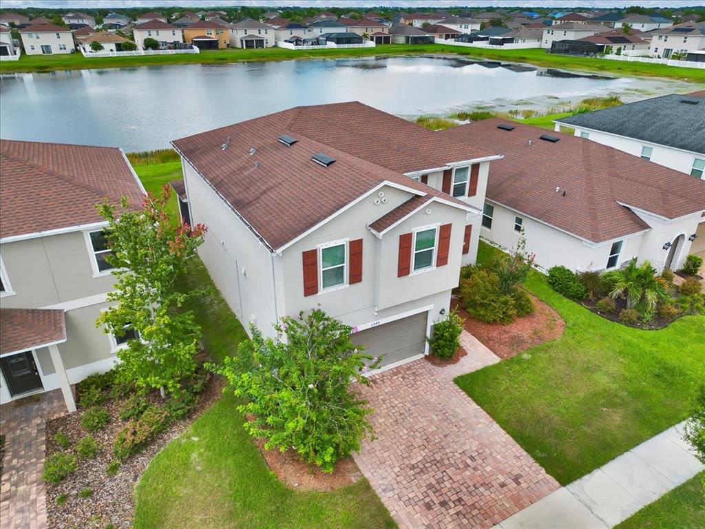 11544 Brighton Knoll Loop Riverview, FL 33579 - Photo 6 of 65 an aerial view of a house with a garden and lake view