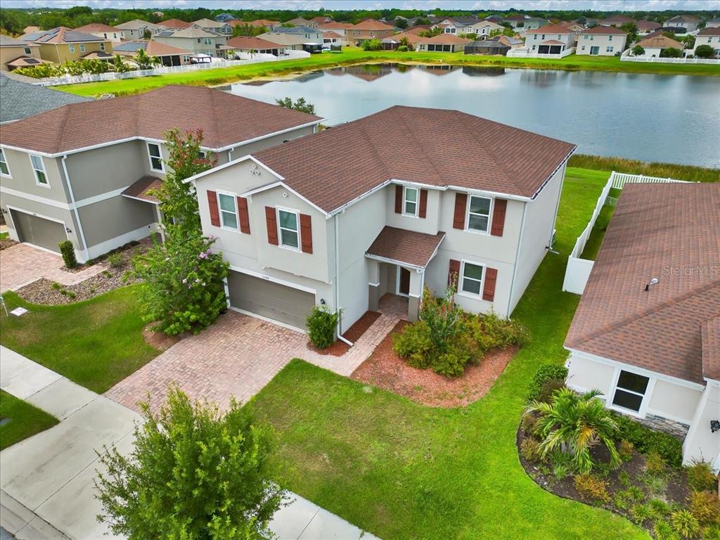 11544 Brighton Knoll Loop Riverview, FL 33579 - Photo 7 of 65 an aerial view of a house with a garden and lake view