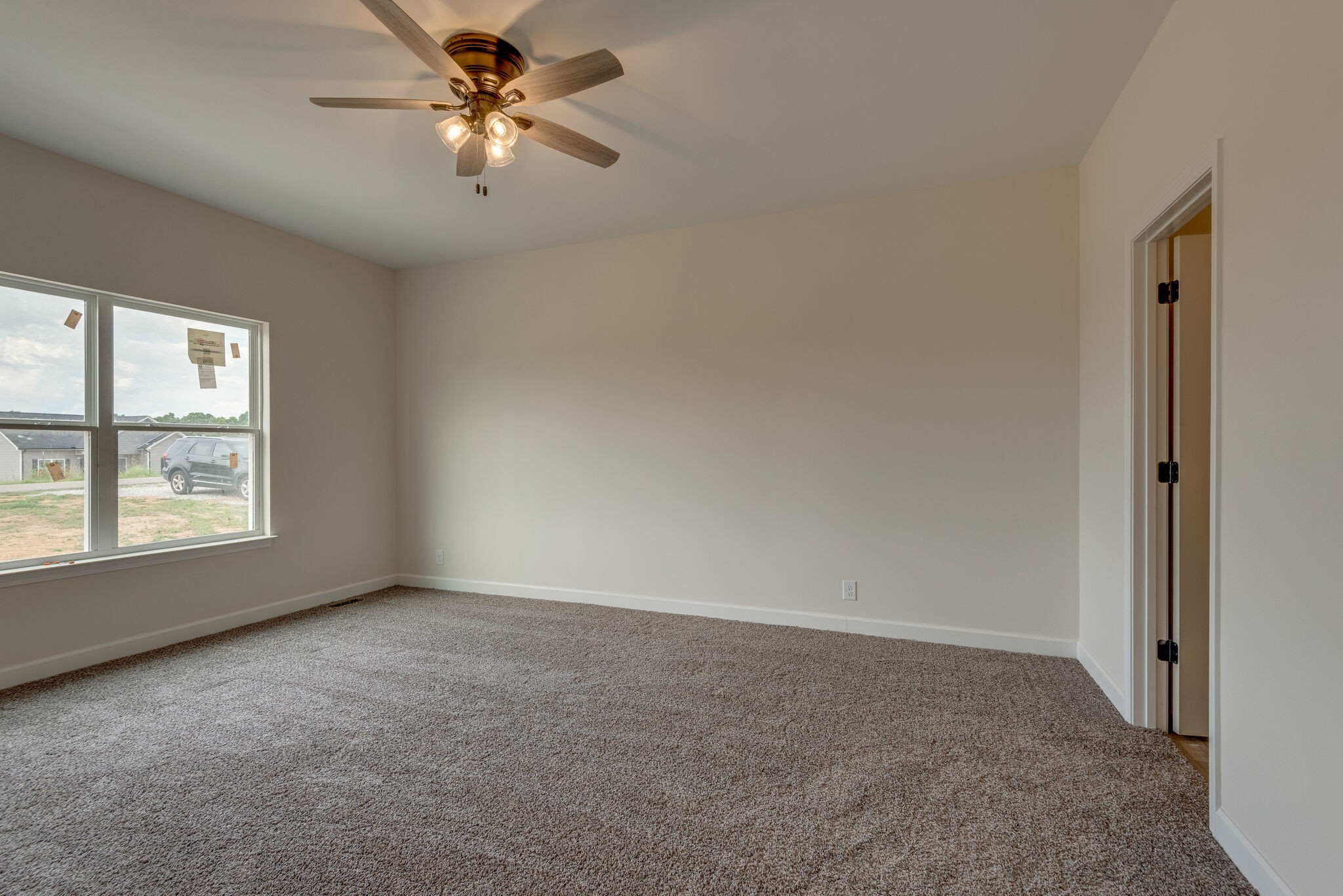 1202 Oak Grove Road Dickson, TN 37055 - Photo 16 of 28 an empty room with windows and fan