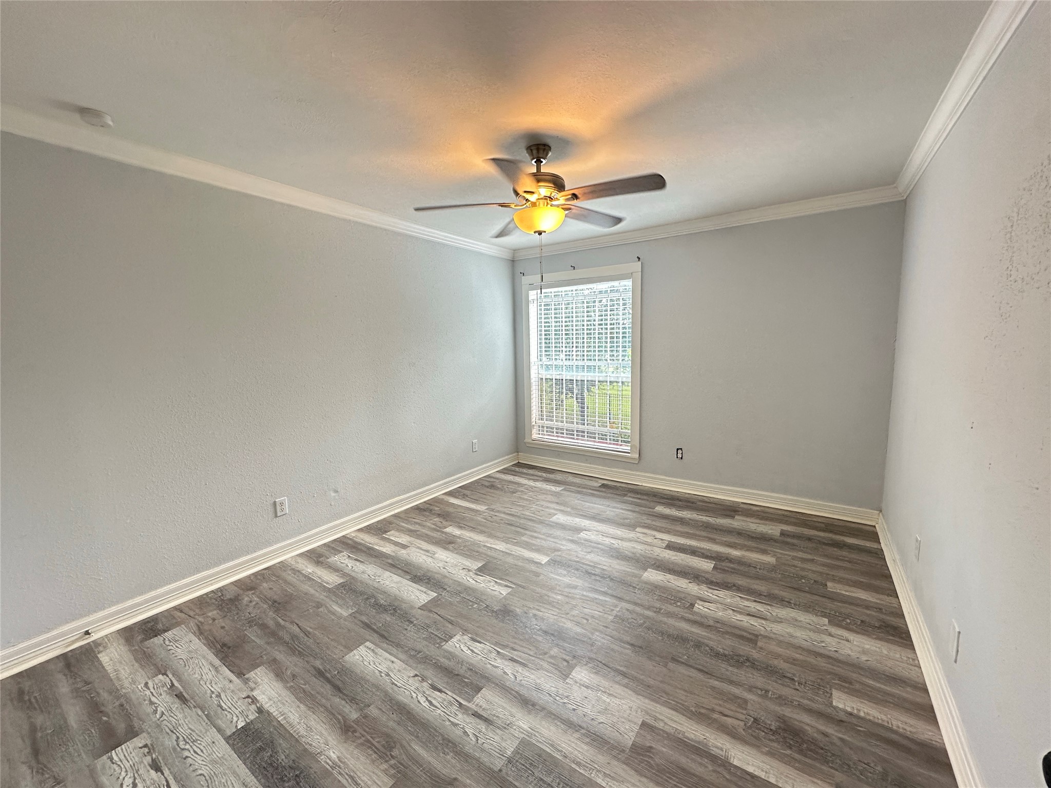 7303 Gulf Freeway, Unit 903 Houston, TX 77017 - Photo 5 of 15 wooden floor in an empty room with a window