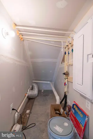 a bathroom with a toilet and a shower curtain