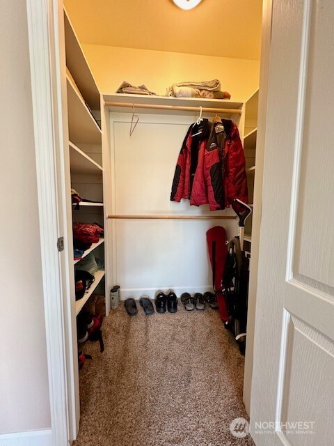 1548 River Road, Unit 105 Longview, WA 98632 - Photo 12 of 25 a view of walk in closet with clothes and shoes