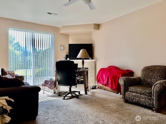 1548 River Road, Unit 105 Longview, WA 98632 - Photo 2 of 25 a living room with furniture and a flat screen tv