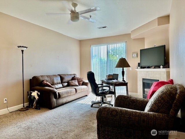 1548 River Road, Unit 105 Longview, WA 98632 - Photo 3 of 25 a living room with furniture and a flat screen tv