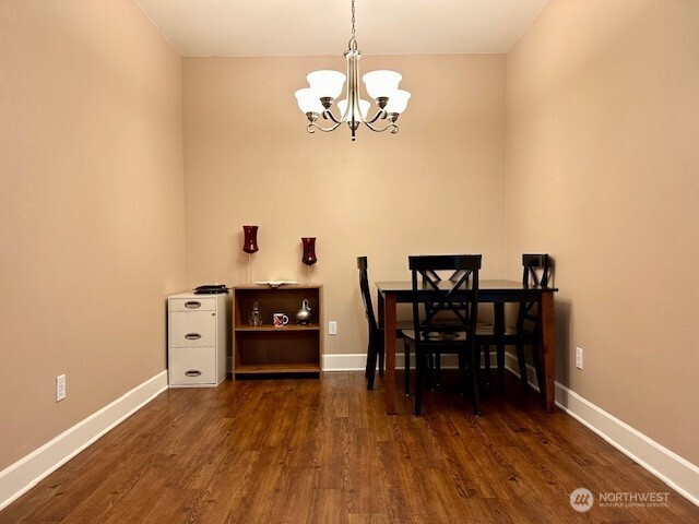 1548 River Road, Unit 105 Longview, WA 98632 - Photo 7 of 25 a view of a dining room with furniture and wooden floor