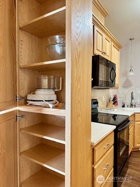 1548 River Road, Unit 105 Longview, WA 98632 - Photo 8 of 25 a kitchen with a sink stove top oven and cabinets