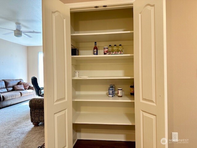 1548 River Road, Unit 105 Longview, WA 98632 - Photo 9 of 25 a living room with a bed and a window