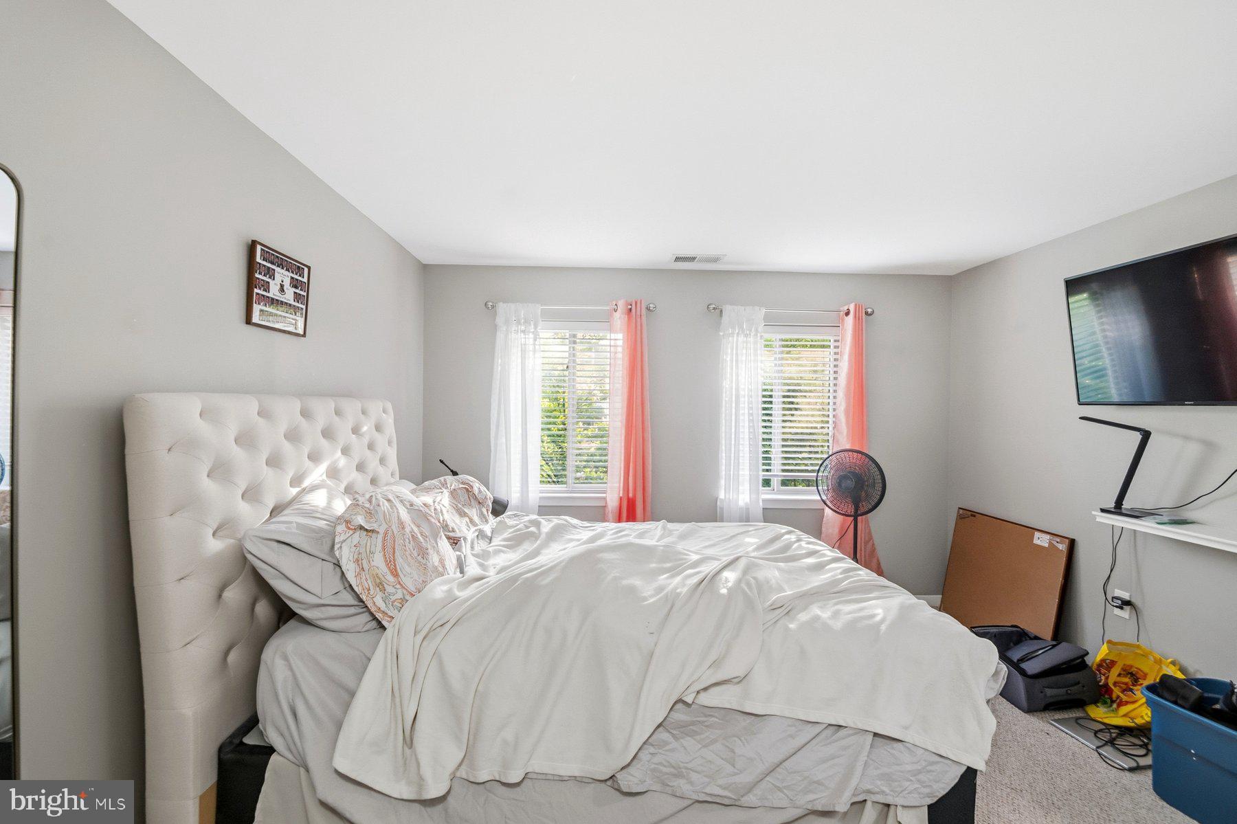 642 South Charles Street, Unit R 22 Baltimore, MD 21230 - Photo 21 of 26 a bedroom with furniture and a flat screen tv