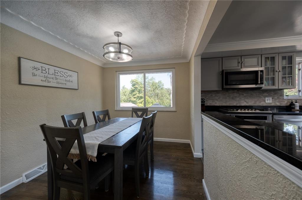2431 Hi Ridge Drive Irwin, PA 15642 - Photo 29 of 47 a view of a dining room with furniture window and wooden floor