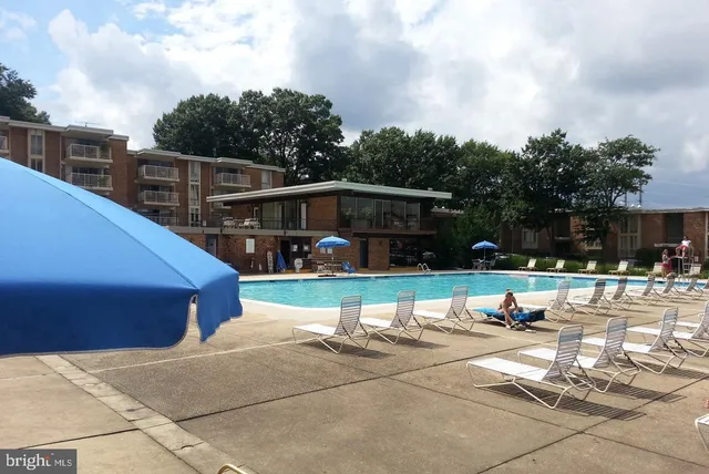 a view of a swimming pool with a patio