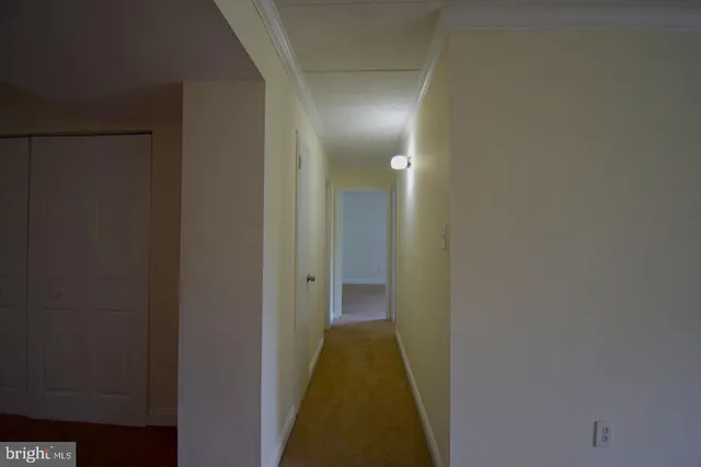 a view of a bathroom from a hallway