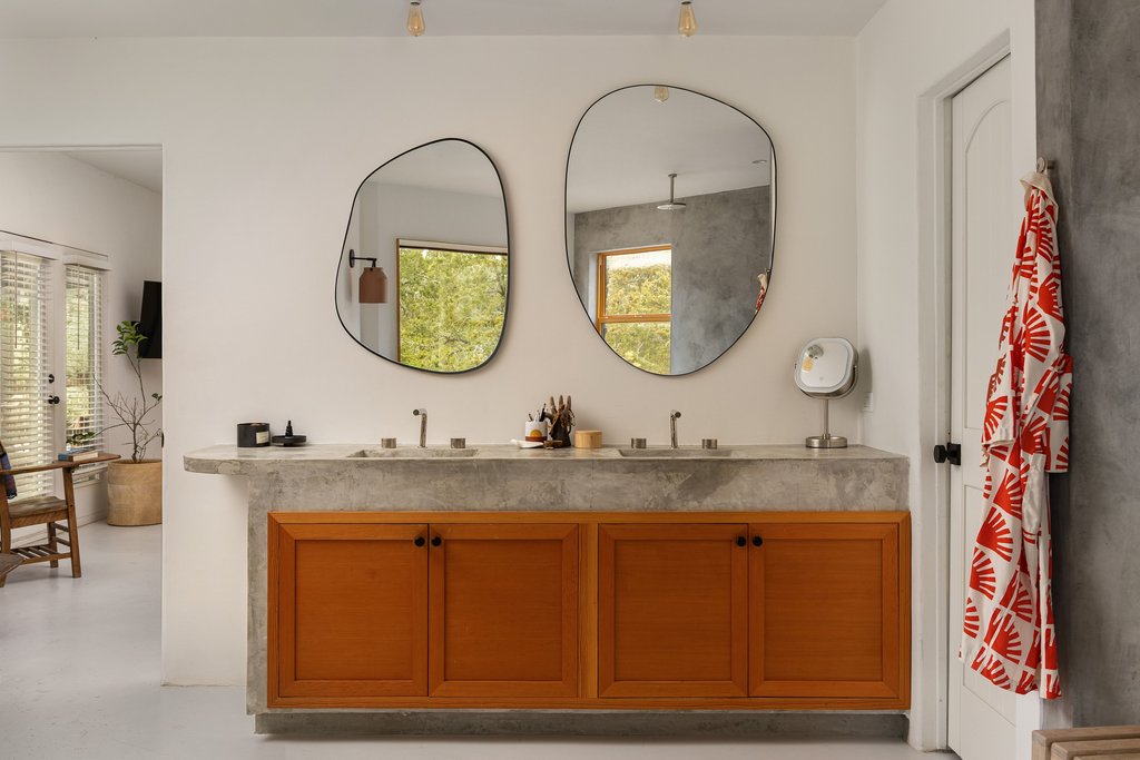 412 Rancho Grande Drive Wimberley, TX 78676 - Photo 17 of 37 Full bathroom featuring double vanity, finished concrete floors, and healthy amount of natural light