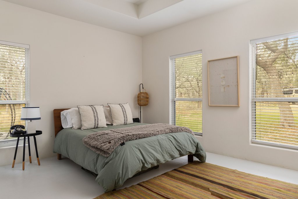 412 Rancho Grande Drive Wimberley, TX 78676 - Photo 19 of 37 View of carpeted bedroom