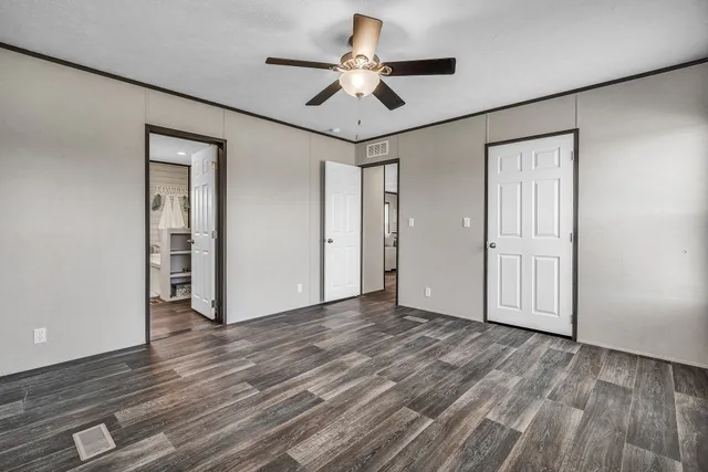 a bathroom with a double vanity sink a mirror and a bathtub