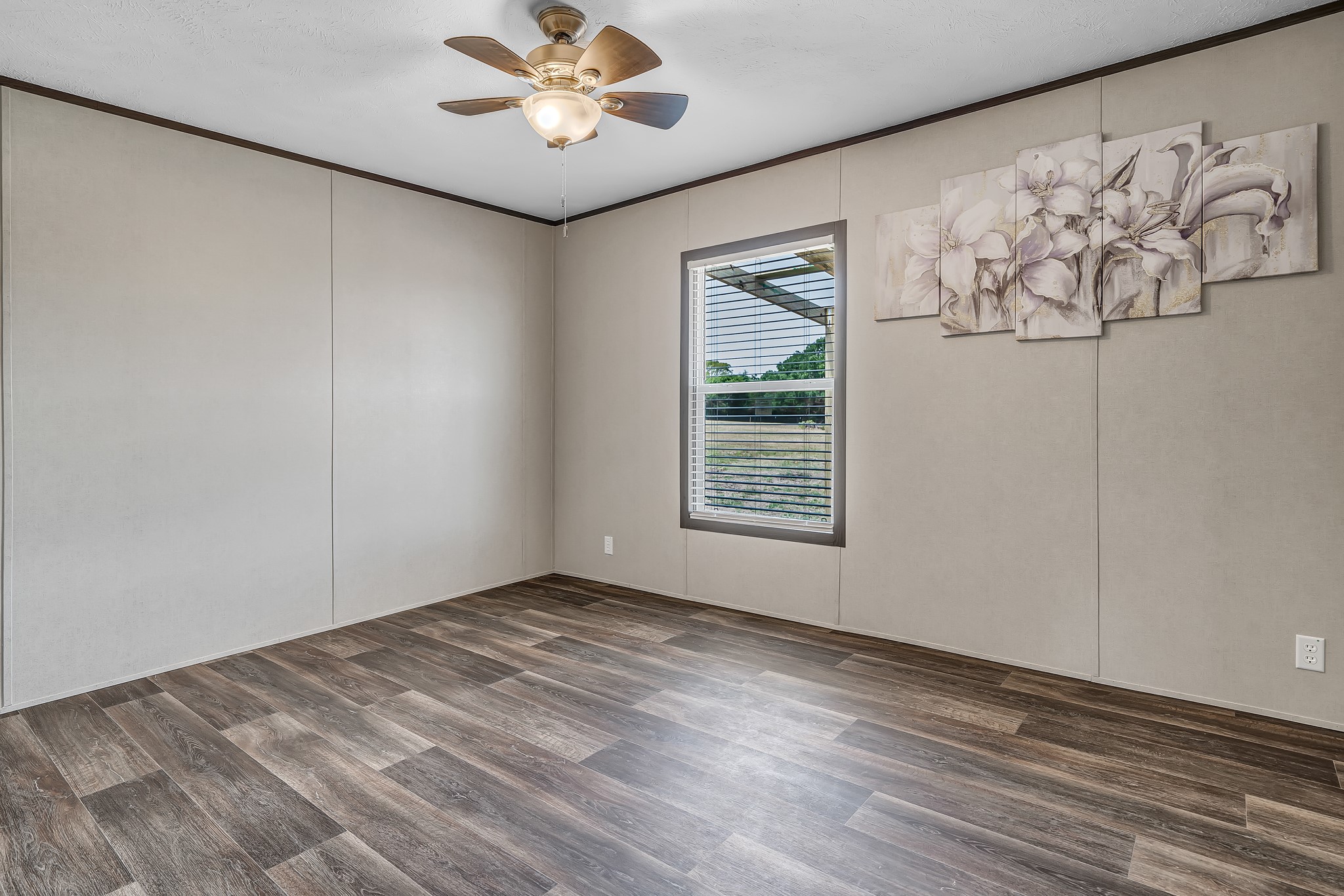 2747 Old Masonic Road Brenham, TX 77833 - Photo 21 of 28 a view of an empty room with a window and wooden floor