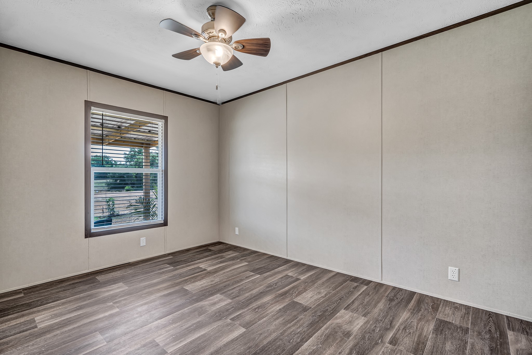 2747 Old Masonic Road Brenham, TX 77833 - Photo 24 of 28 a view of an empty room with a window and hardwood floor